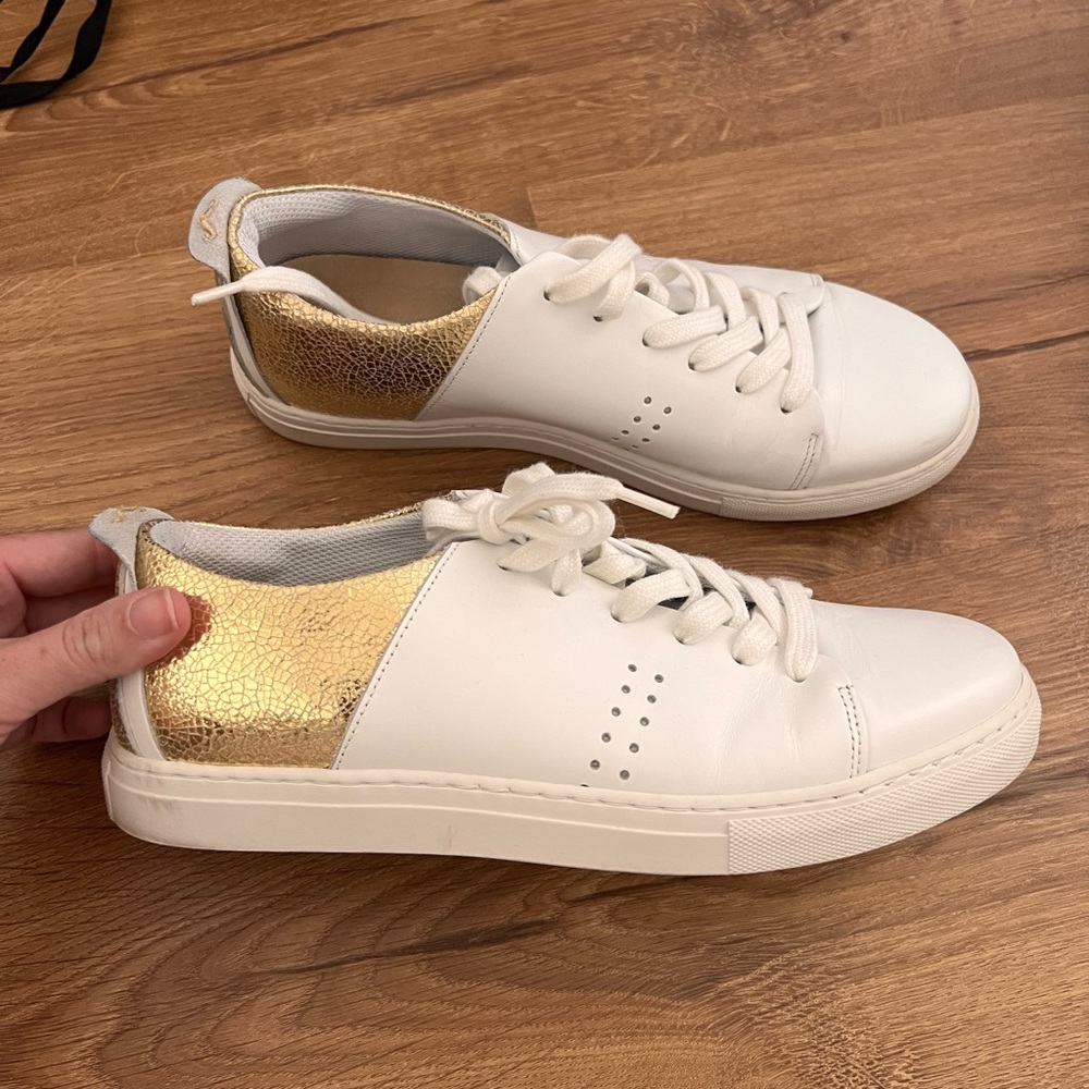 White and gold sneakers